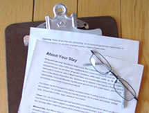 A picture of a pair of glasses resting on a print-out of "About Your Stay"