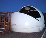 A picture of one of our clamshell domes partially open